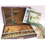 A vintage Box of fishing floats and some books. Po