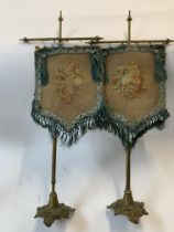 A pair of Victorian tapastry table screens with gilt metal bases. 53cm.