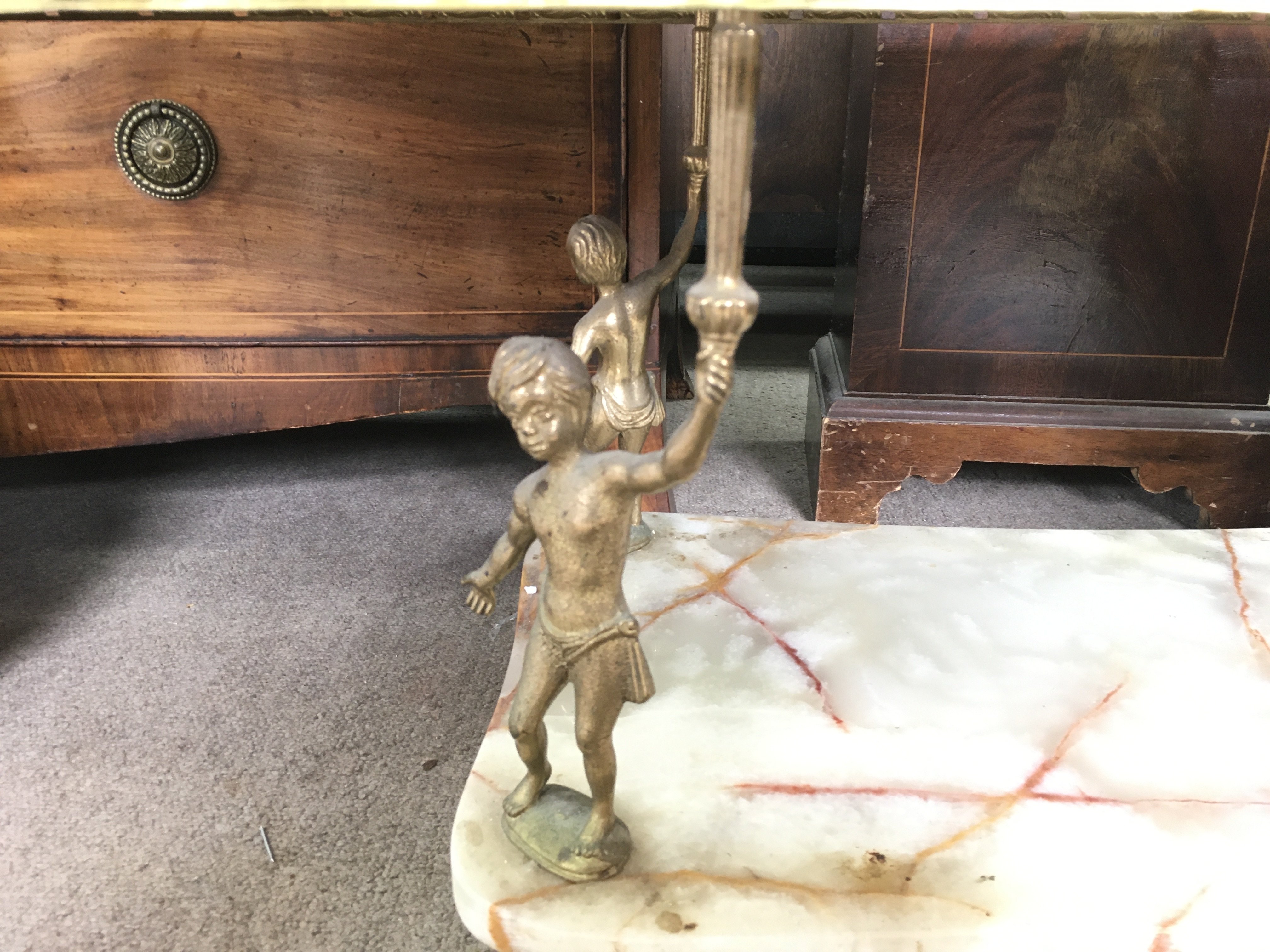 A Green Onyx gilt and brass coffee table supported by four Putto figures. Dimensions 47x107x45cm - Image 3 of 3