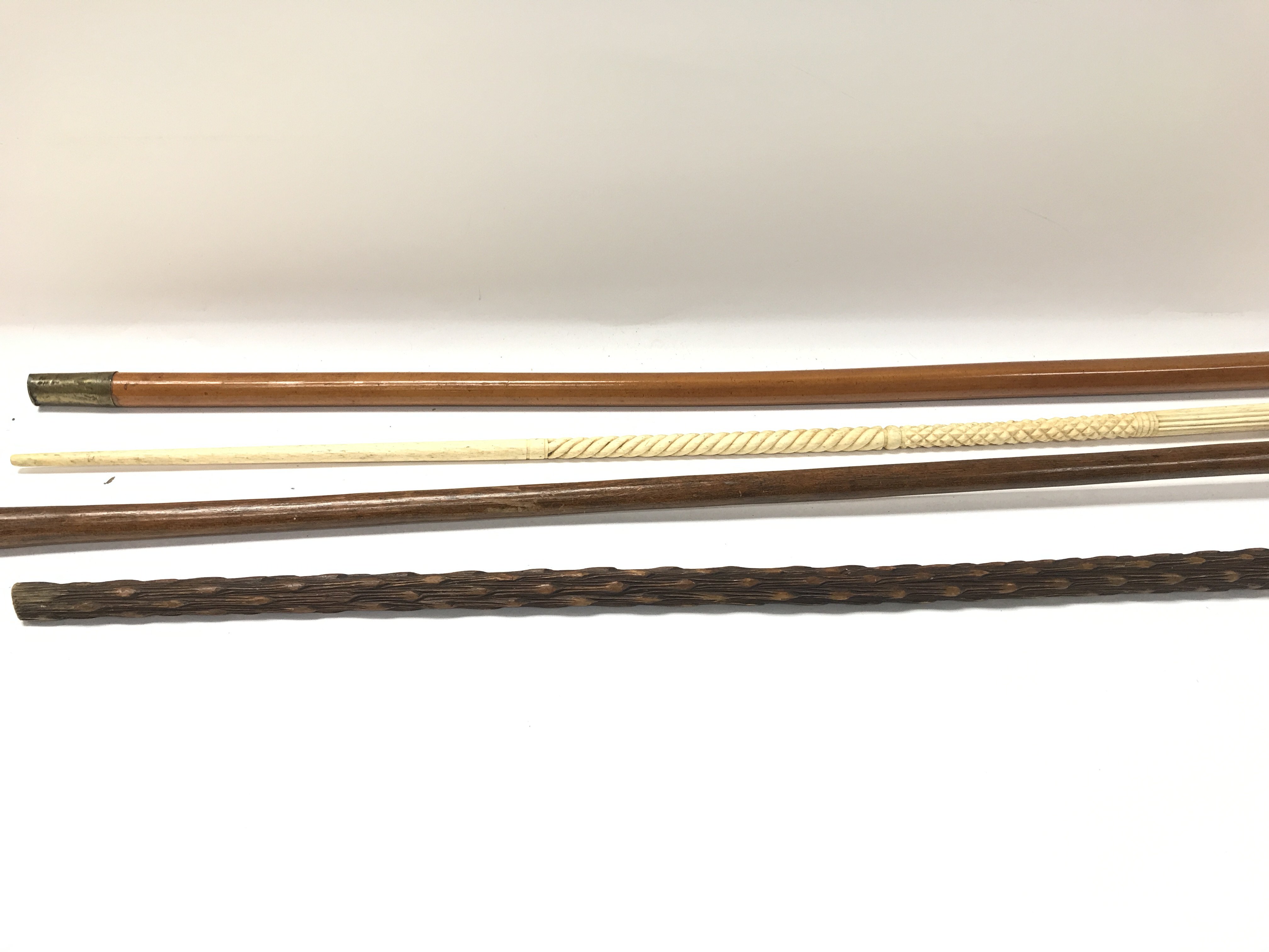 A collection of four walking sticks. - Image 3 of 4