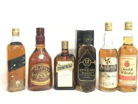 A collection of vintage whiskeys including Cointre