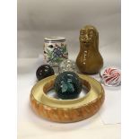 A collection of ceramics and paperweights.