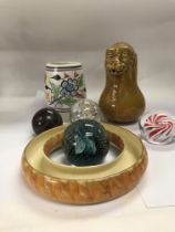 A collection of ceramics and paperweights.