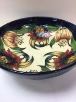 A Moorcroft bowl decorated in Anna LiLy pattern.