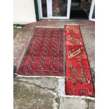 A hand knotted rug runner with an unusual pattern