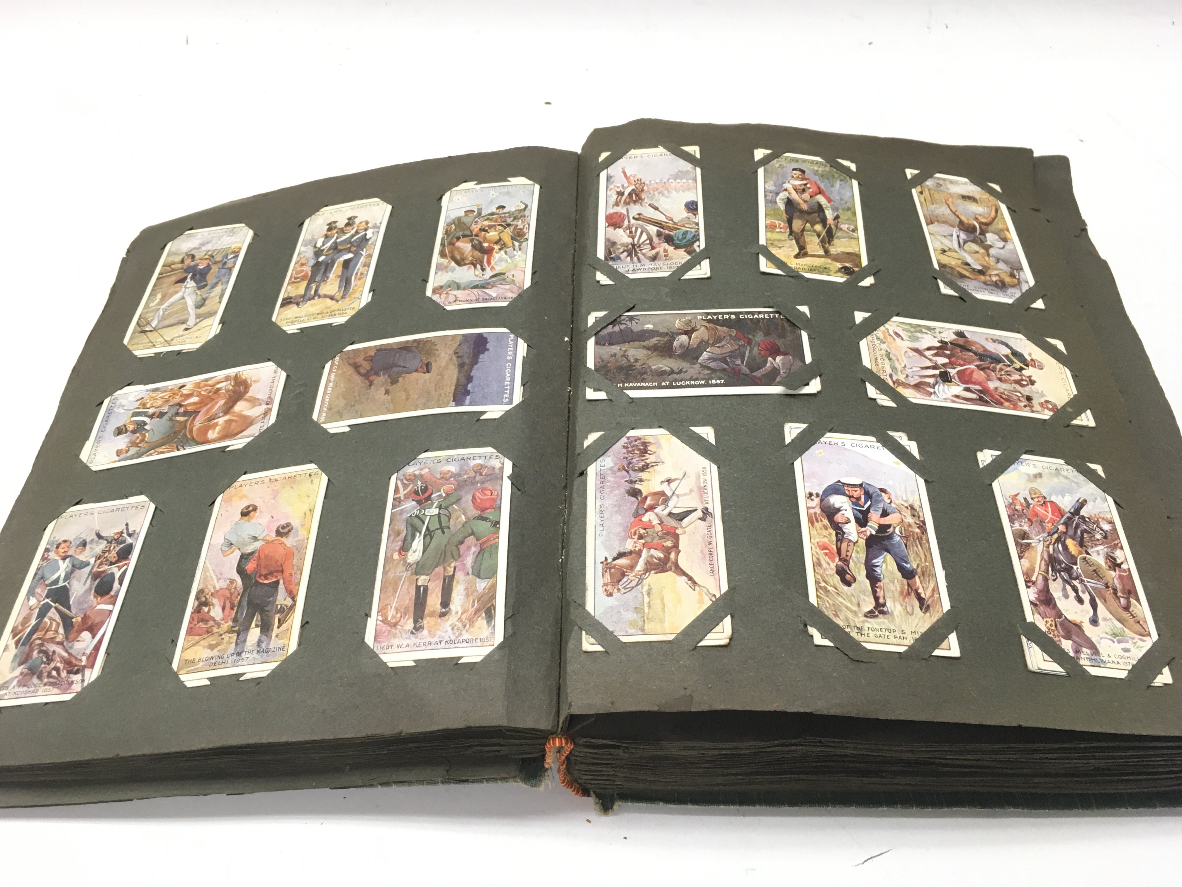 An album containing a large number of vintage cigarette cards. - Image 9 of 12