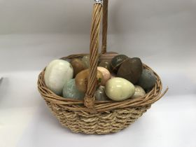 A basket of stone and marble eggs.