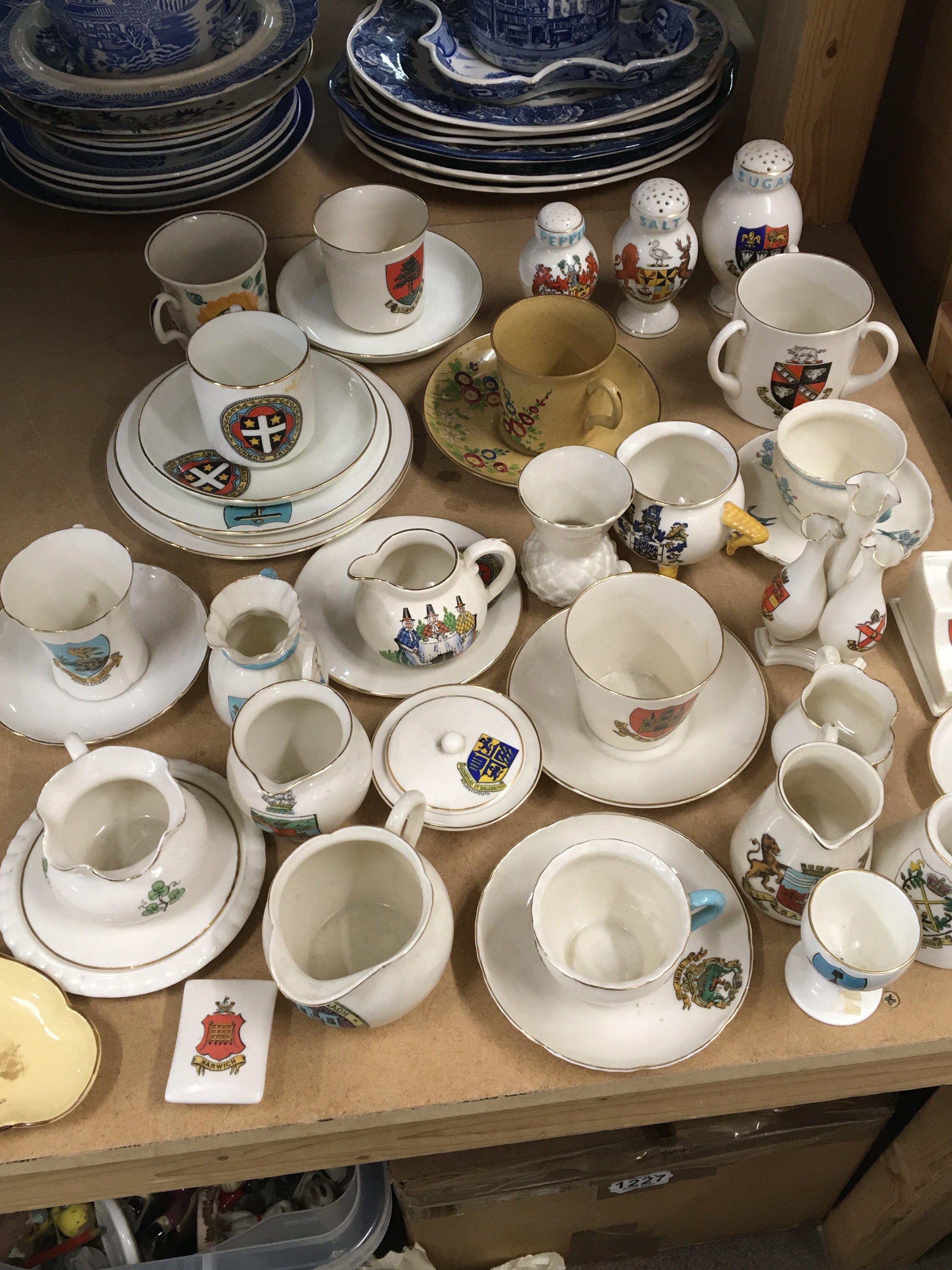 A collection of Goss crested china condiments cups