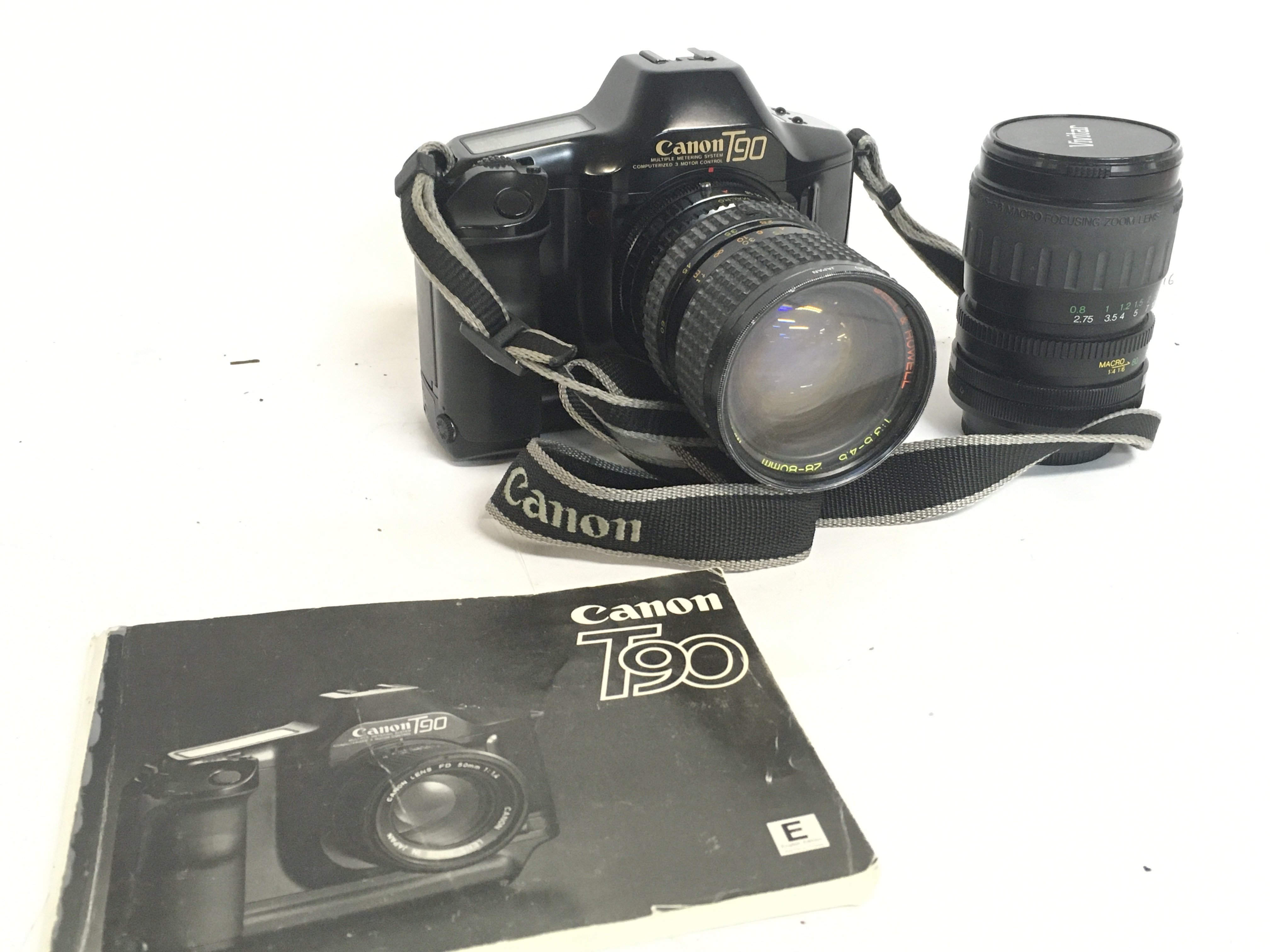 A Canon T90 Camera with a Bell & Howell 28-80mm le