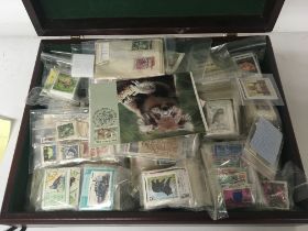 A large quantity of world stamps in albums and loo