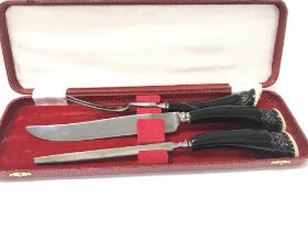 A modern carving set in case.