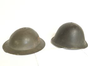 A pair of helmets including a Brodie helmet. This lot cannot be posted