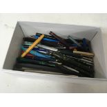 A box containing fountain pens and other pens.