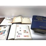 A large collection of stamp albums containing worl