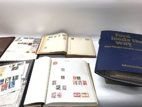 A large collection of stamp albums containing worl
