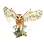 A Franklin Mint screech owl, approximately 32cm ta