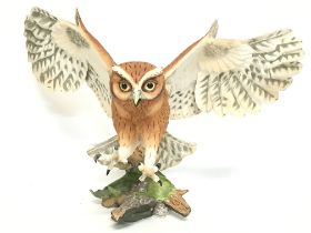 A Franklin Mint screech owl, approximately 32cm ta