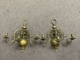 A pair of colonial style brass 3 branch wall sconc