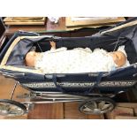 A vintage dolls pushchair and two dolls along with