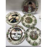 A collection of decorative plates and meat plates.