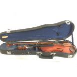 A cased students violin, 49cm long. Postage catego