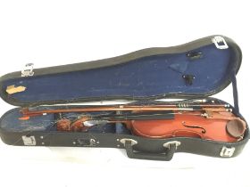 A cased students violin, 49cm long. Postage catego