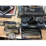 A vintage Royal typewriter and a telephone. This lot cannot be posted