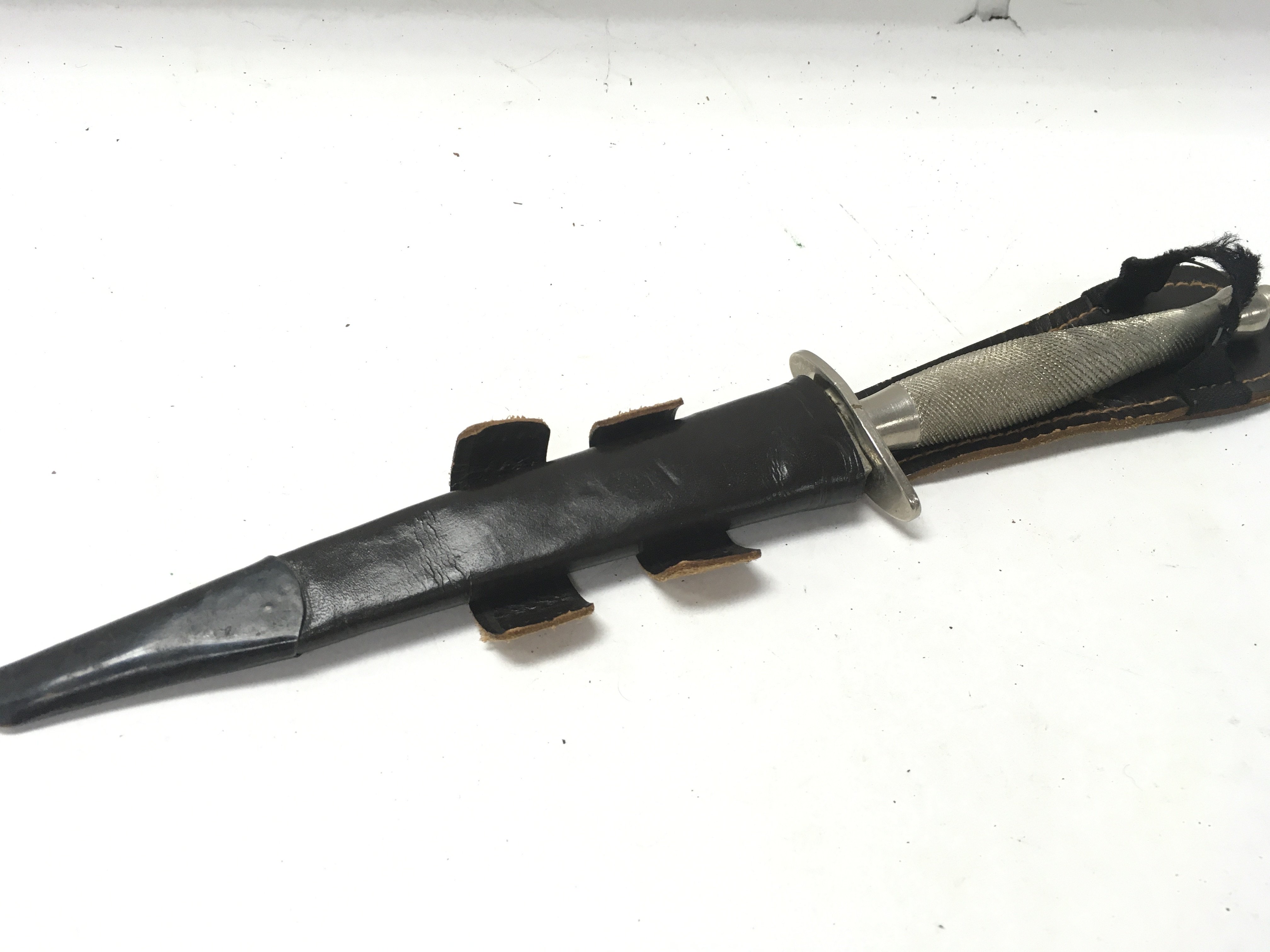 A Fairbairn Sykes fighting knife with leather scab - Image 4 of 4