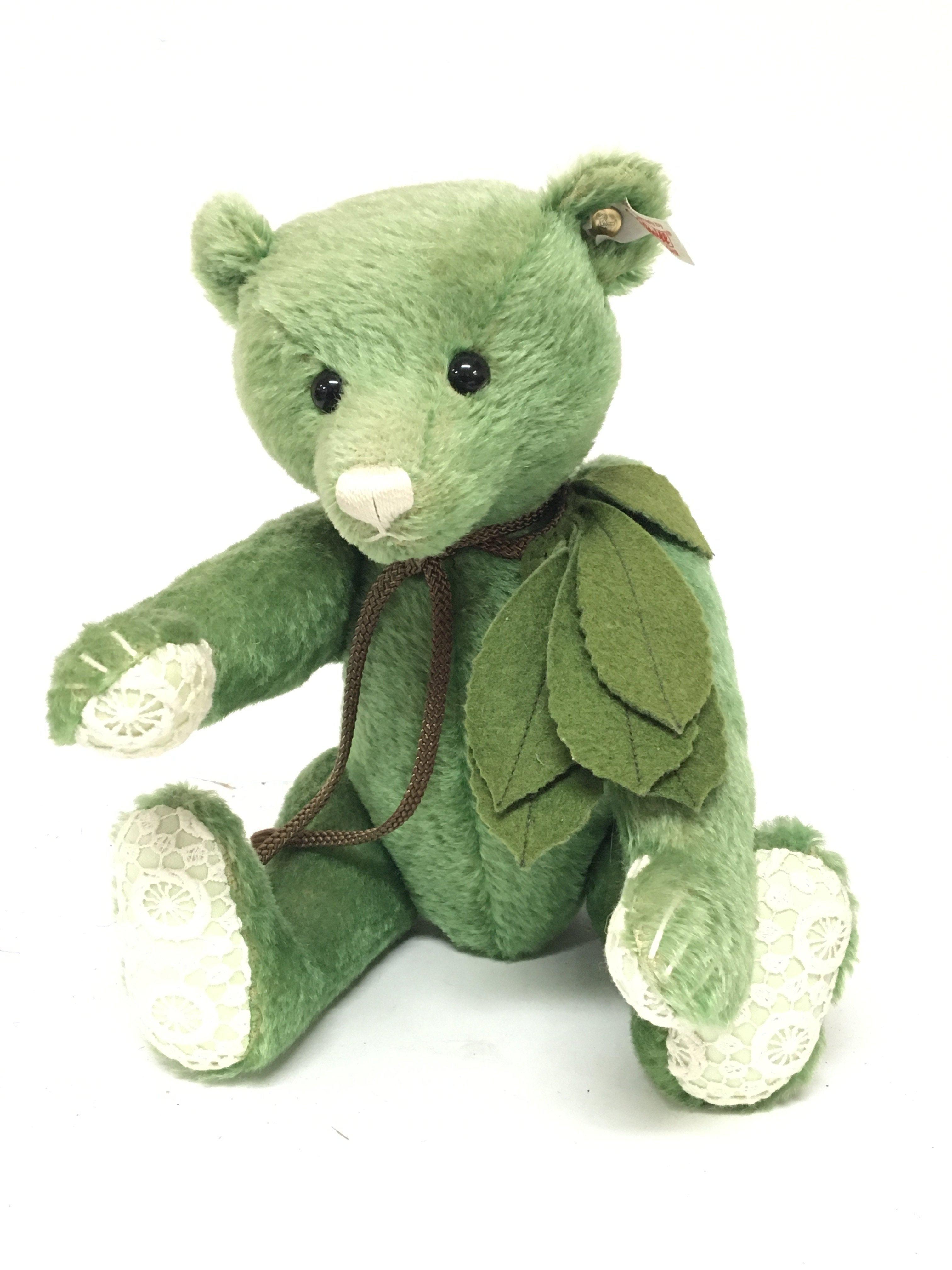 An unusual Green Steiff bear with crouched paws an