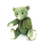An unusual Green Steiff bear with crouched paws an