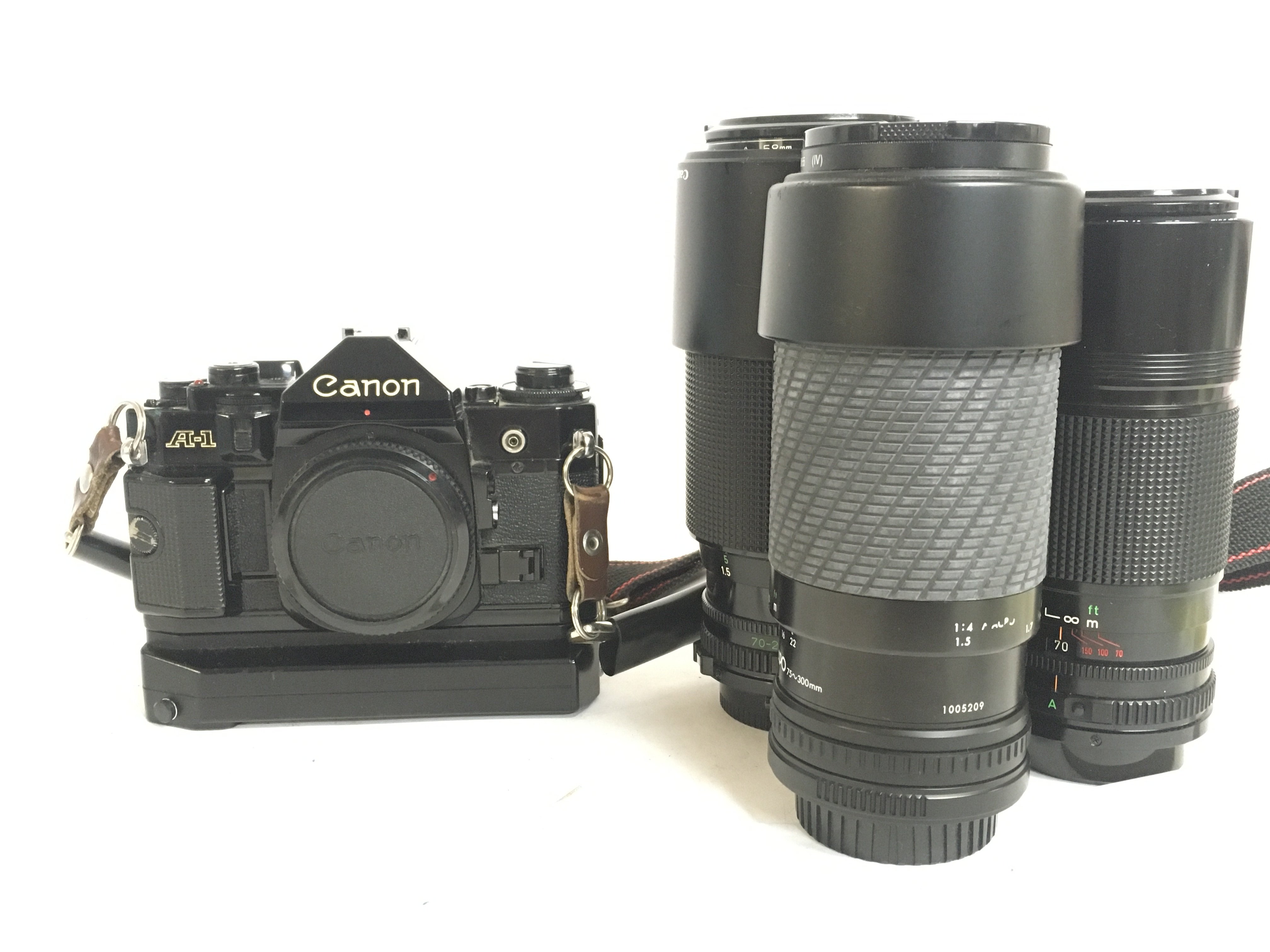 A Canon A-1 camera including FD 70-210 1:4 lens, F