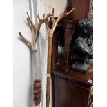 2 stag horn topped walking sticks.