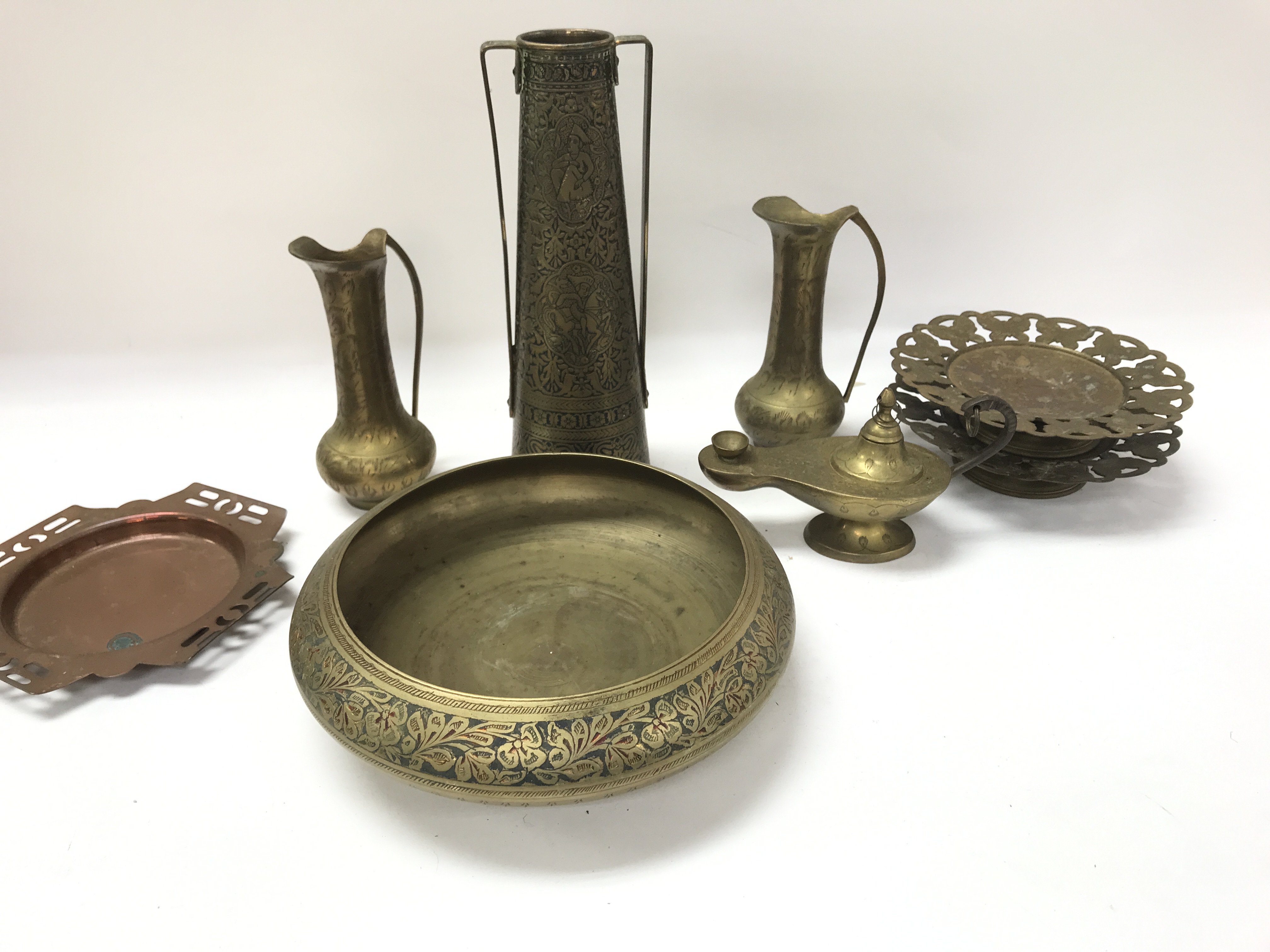 A collection of various items of brass wear.