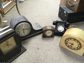 A collection of vintage mantle clocks, midgetronic EMU 4214 radio, a telephone. This lot cannot be