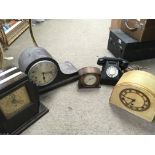 A collection of vintage mantle clocks, midgetronic EMU 4214 radio, a telephone. This lot cannot be