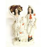 A Staffordshire figure group of a rural couple. 30
