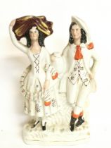 A Staffordshire figure group of a rural couple. 30