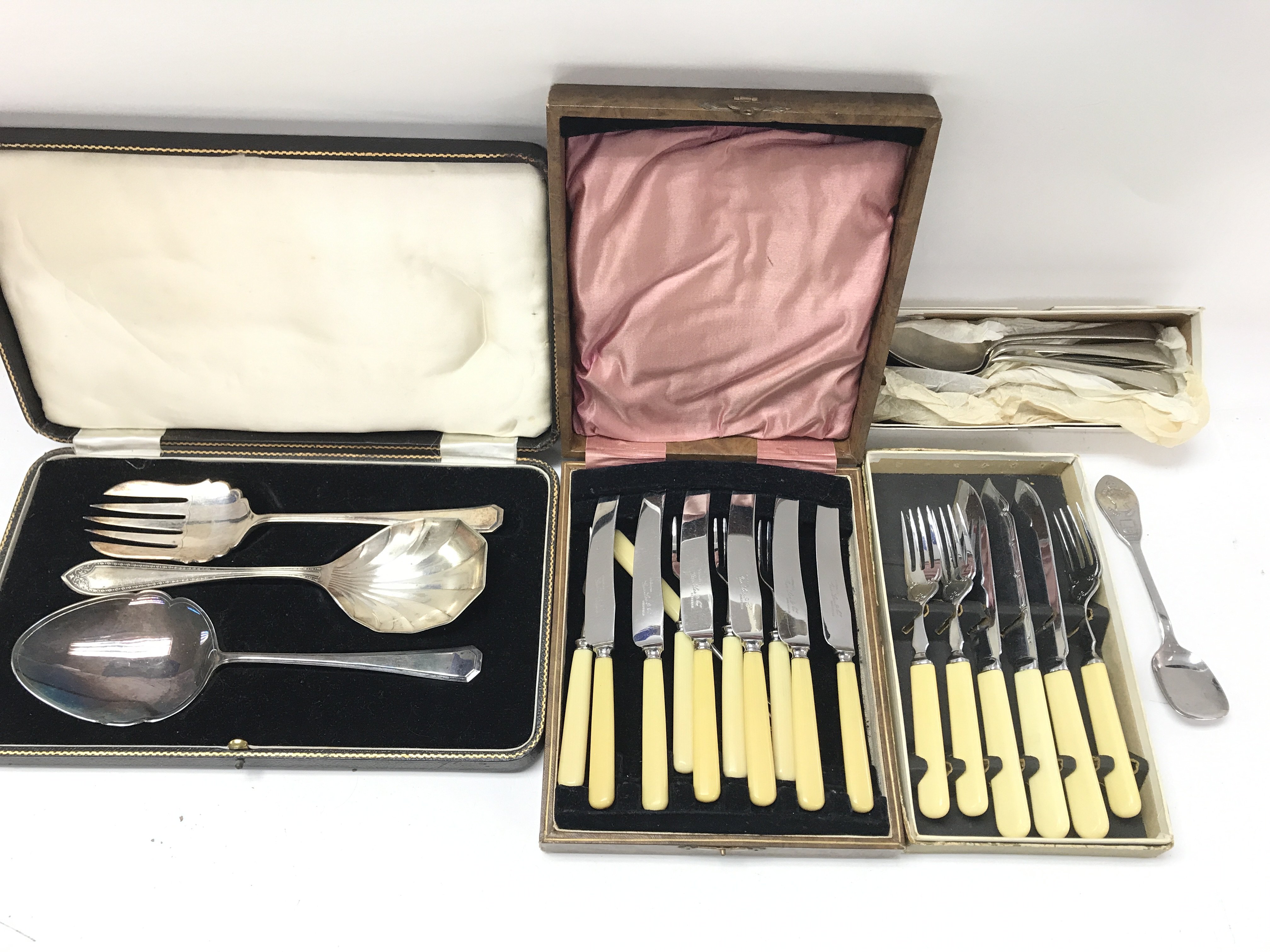 A collection of assorted cutlery including silver