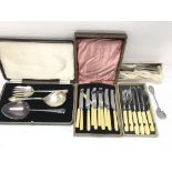 A collection of assorted cutlery including silver