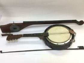 A banjolele and a monochord (2). Shipping category D.