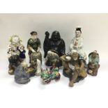 A collection of mainly Oriental figures. Shipping