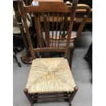 A elm stick back rocking chair with rush seat- NO