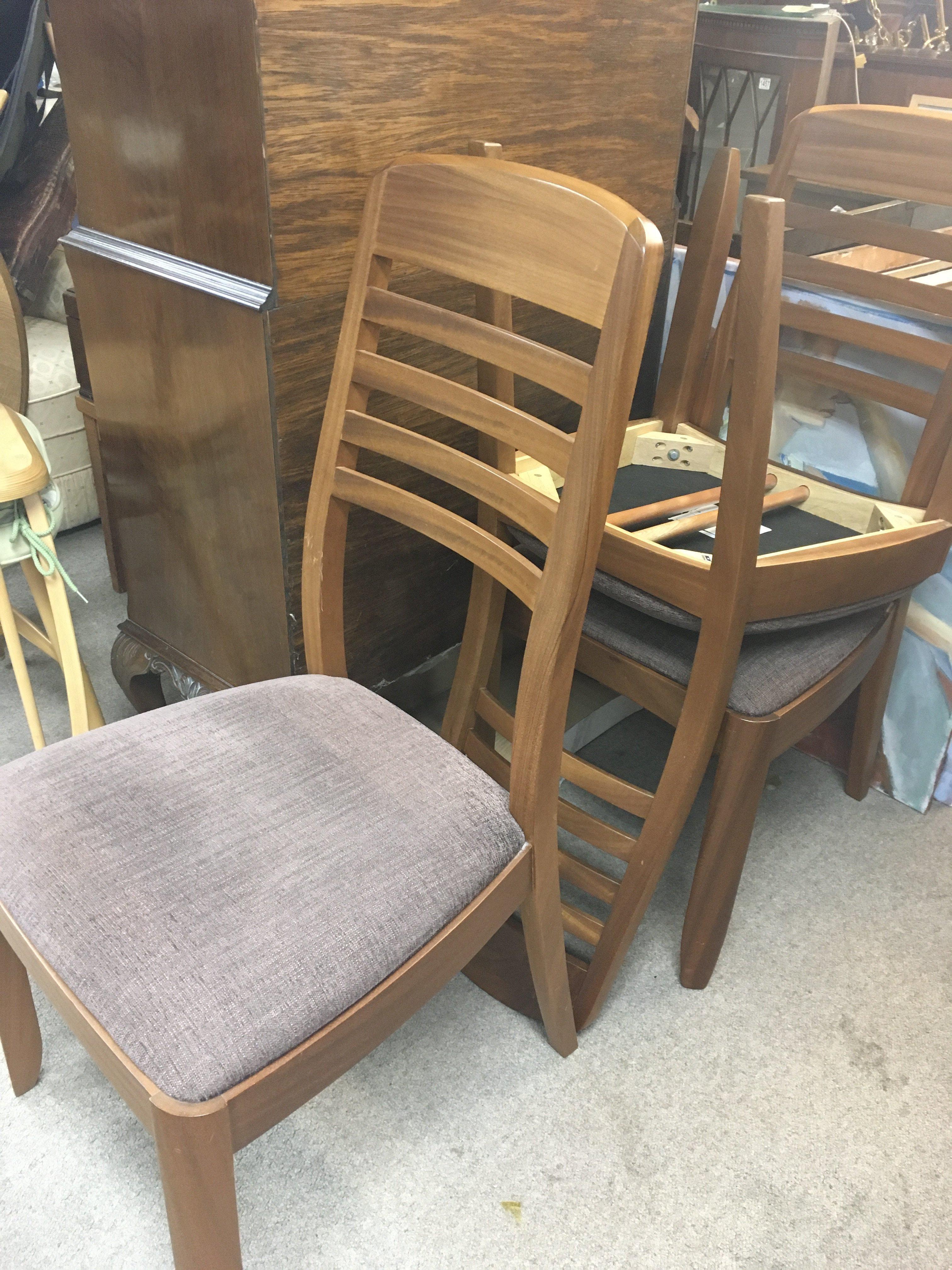 A modern teak dining table and four chairs. Table - Image 4 of 4