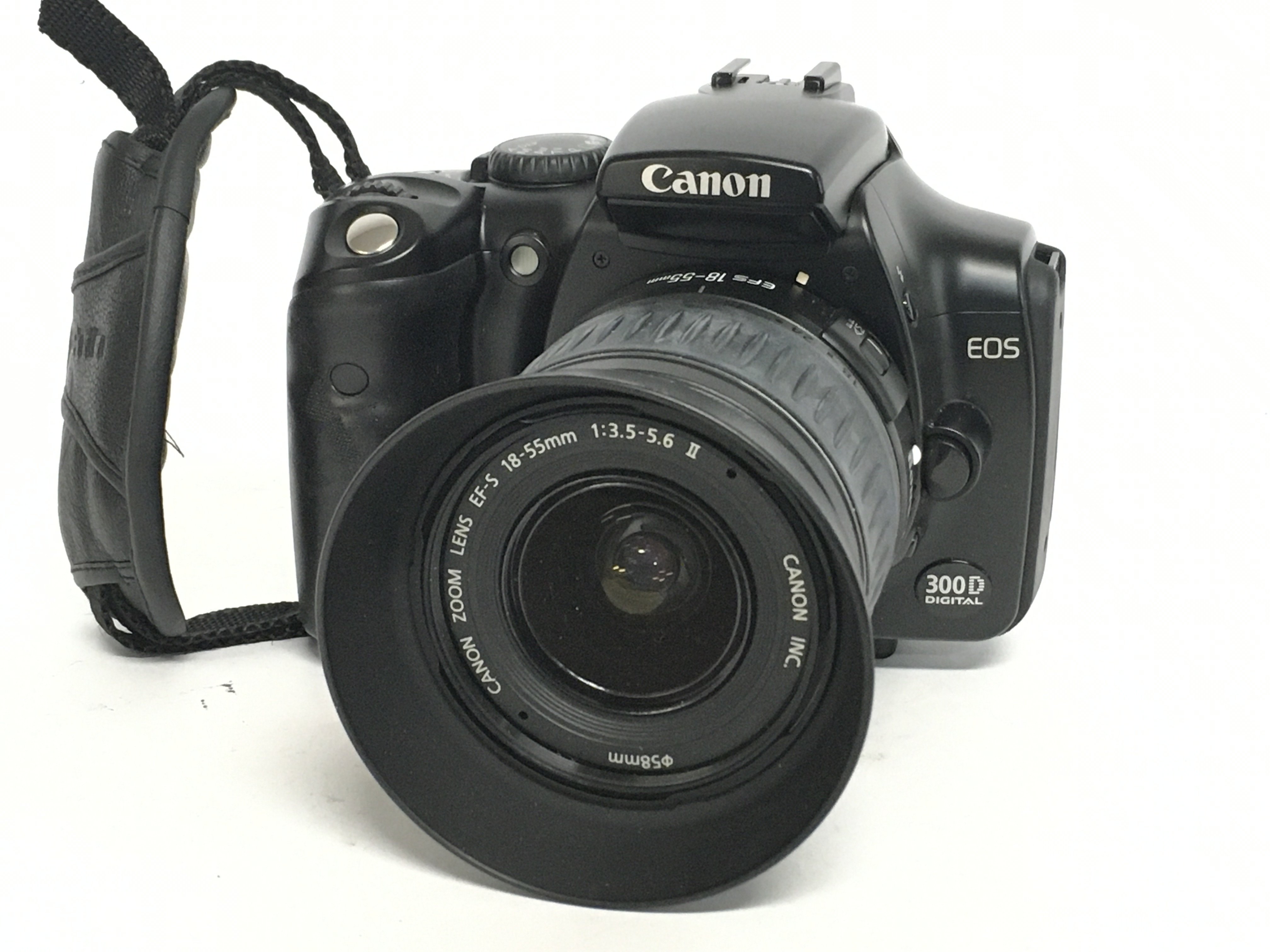 A Canon EOS 300D camera with EW-60C lens. Postage