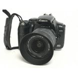A Canon EOS 300D camera with EW-60C lens. Postage