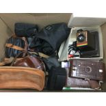 A collection of vintage camera equipment and binoc