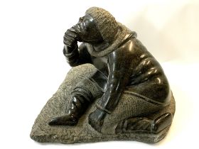 A large Inuit hand carved soapstone sculpture of a