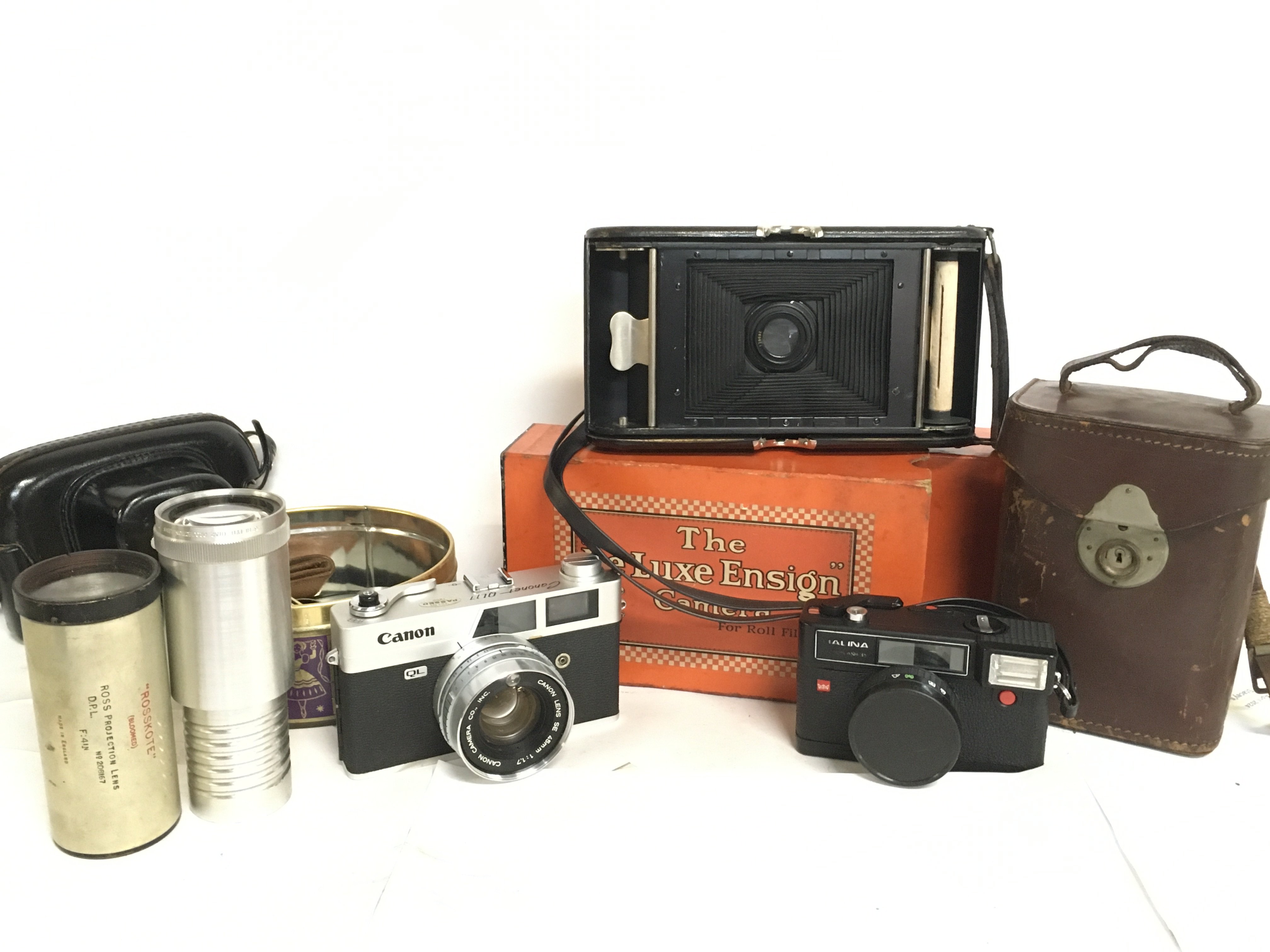 A collection of camera equipment including a Canon