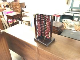 A vintage wooden abacus lamp.