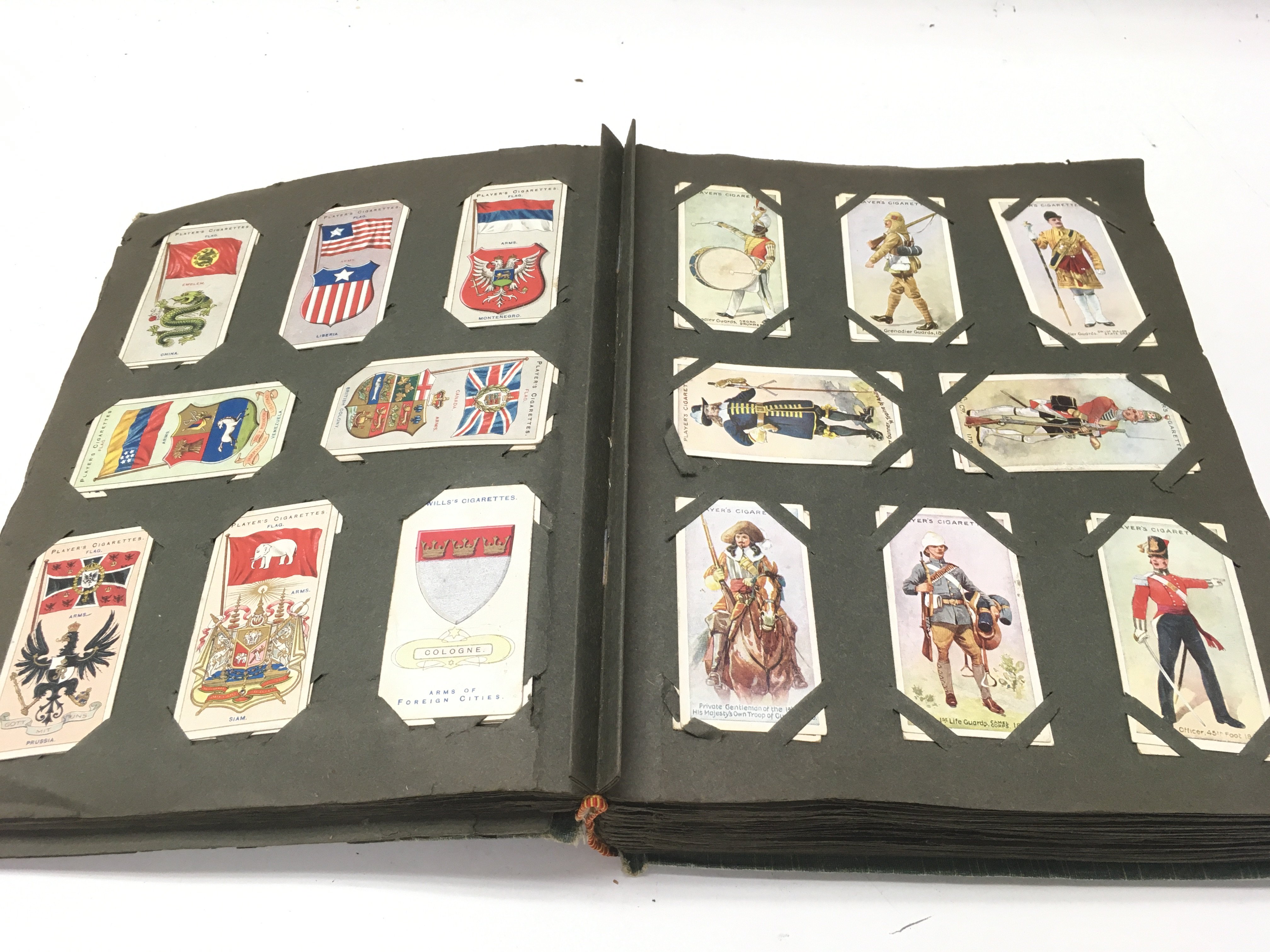 An album containing a large number of vintage cigarette cards. - Image 8 of 12